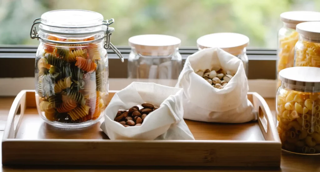 Food items stored in jars and reusable bags, promoting zero waste living.